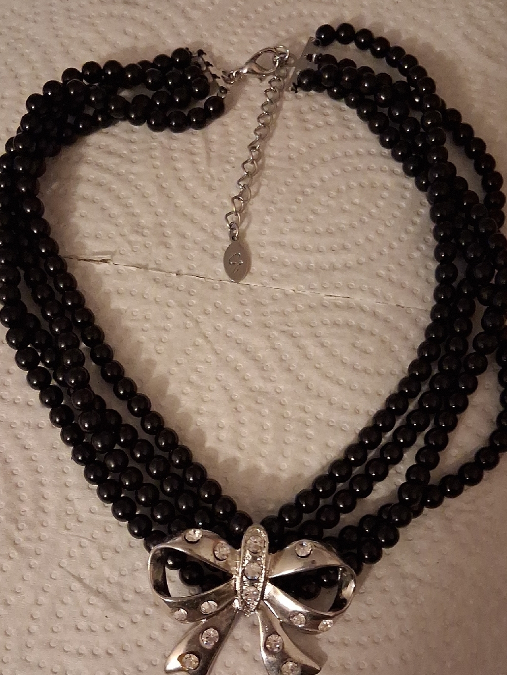 Multi-Strand Black Bead Necklace with Silver Bow Accent